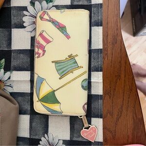 SOLD-Dooney and Bourke white Miami Beach zip wallet